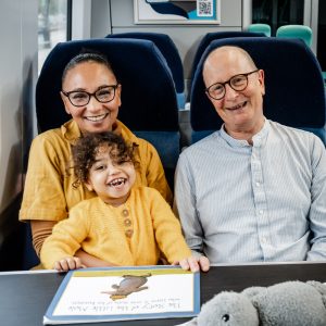 daughter, mum and grandad on train, national adoption week