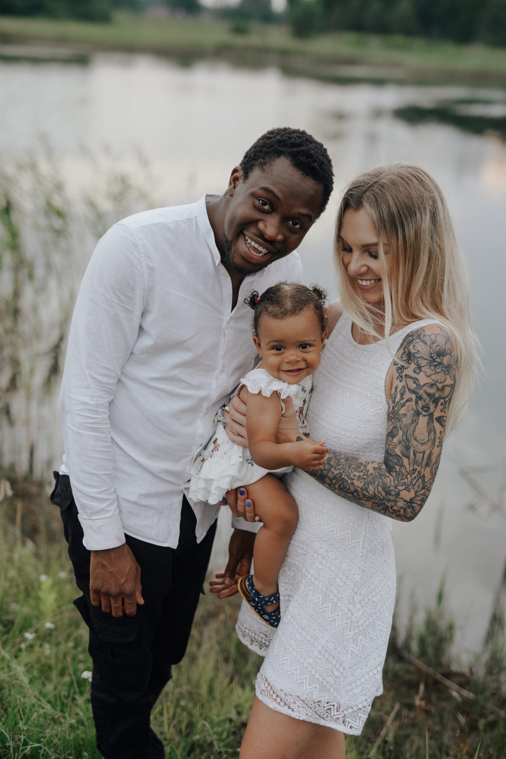 Happy,Multiethnic,Family,Posing,Together,Looking,At,Camera